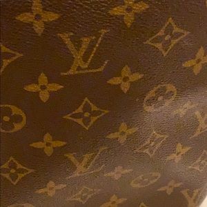 Crossbody bag with minor scratches.